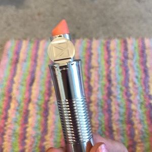 A coral lip shimmer never used that u twist